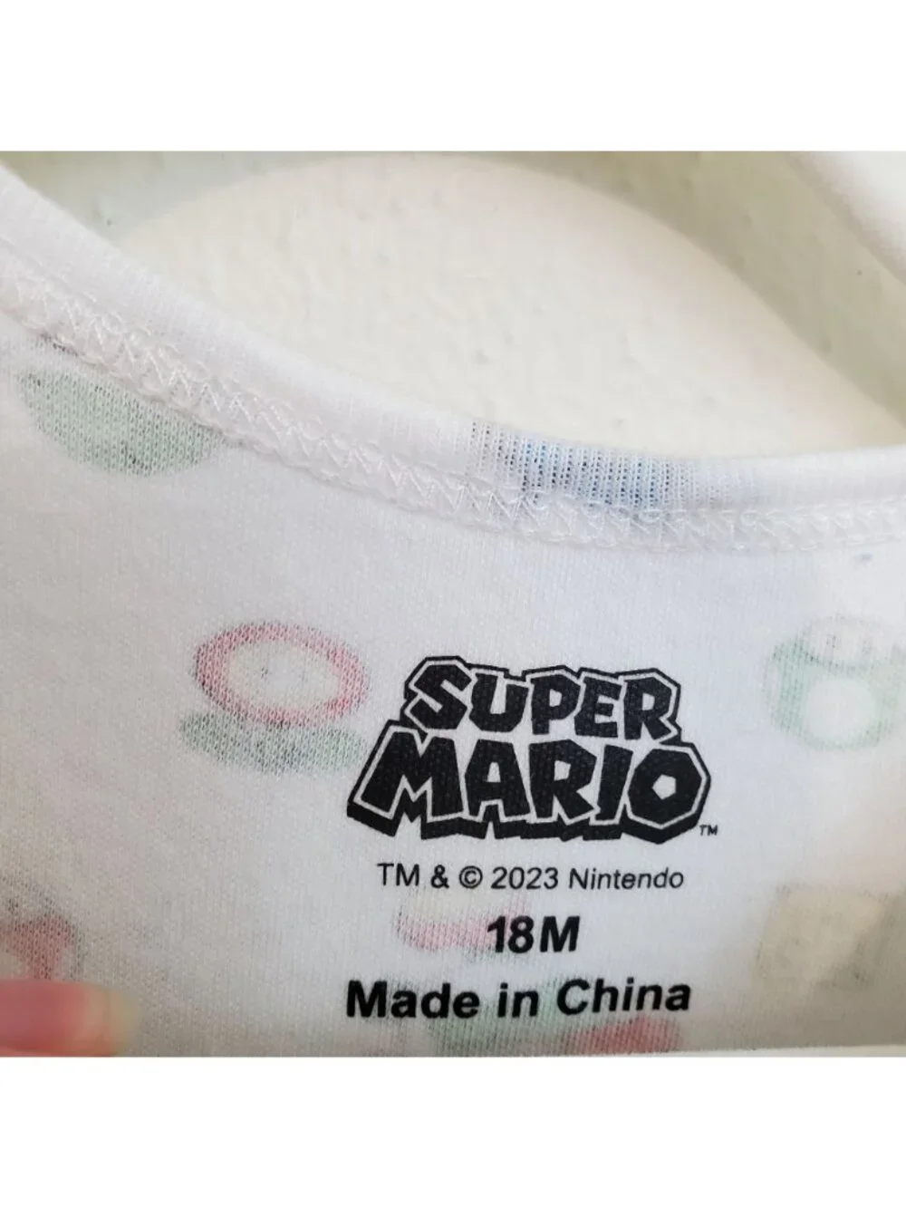 Super Mario Nintendo all-over-print baby onesie
